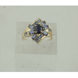 9ct Gold Gem Set Cluster Ring, set with a central sapphire style stone, flanked with allover