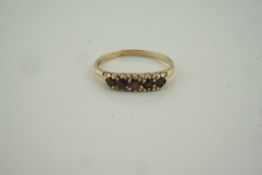 9ct Gold Garnet Five Stone Ring, set with five small garnets, stamped 375, overall weight 1.99