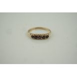 9ct Gold Garnet Five Stone Ring, set with five small garnets, stamped 375, overall weight 1.99