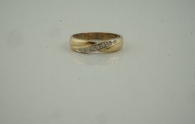 Gold and Diamond Ring, set with diamond chips, unmarked, overall weight 2.5 grams, ring size Q