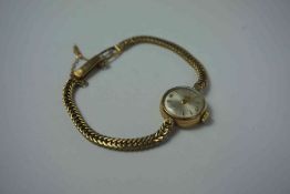 Tudor Rolex 9ct Gold Ladies Wristwatch, Having a Silvered dial with Gold baton markers, Stamped