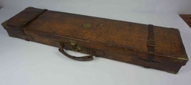 Tan Leather Gun Case, circa 19th century, Decorated with Brass mounts, Having a green Baise lined