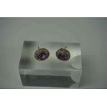 Pair of 9ct Gold Amethyst & Diamond Earrings, Set with an oval Amethyst cabochon, Surrounded by