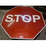 Painted Stop Sign, Affixed to a Wooden Table, 46cm high, 75cm wide