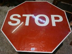 Painted Stop Sign, Affixed to a Wooden Table, 46cm high, 75cm wide