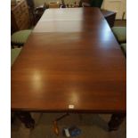 Mahogany Extending Dining Table, circa early 20th century, Having two spare leaves, Raised on