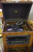 Vintage H.M.V Walnut Gramaphone, 112cm high, 49cm wide, 42cm deep, With a quantity of 7 inch Vinyl