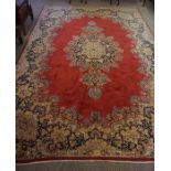 Persian Carpet, Decorated with Floral medallions on a red ground, 252cm x 362cm