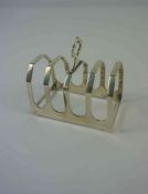 George V Silver Four Bar Toast Rack, Hallmarks for Sheffield 1934-35, 7cm high, 8cm wide, 1.79 ozt