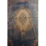 Chinese Style Carpet, Decorated with Floral medallions on a blue ground. Approximately 370cm x