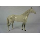 Beswick Figure of a Dapple Grey Horse, Marked to underside, 30cm high, 42cm wideCondition