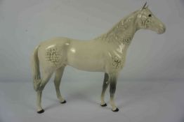 Beswick Figure of a Dapple Grey Horse, Marked to underside, 30cm high, 42cm wideCondition