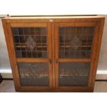 Oak Bookcase, circa early 20th century, Having two leaded glazed doors, Enclosing a shelved