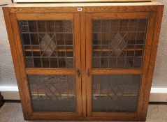 Oak Bookcase, circa early 20th century, Having two leaded glazed doors, Enclosing a shelved