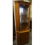 Teak Style Corner Cabinet, Having a glazed door enclosing a shelved interior, Above a Cupboard door,