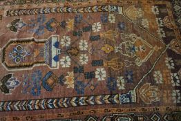 Afghan Bluch Rug, Decorated with Geometric medallions on a pink ground