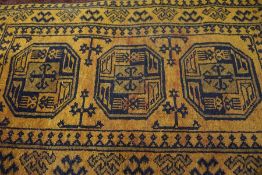 Afghan Bluch Rug, Decorated with Geometric motifs on an orange ground, 138cm x 73cm