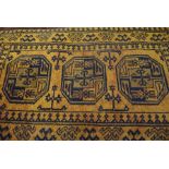 Afghan Bluch Rug, Decorated with Geometric motifs on an orange ground, 138cm x 73cm