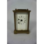 Brass Carriage Clock, Having a white enamel dial, 11cm high, Engraved to top of Clock, No key