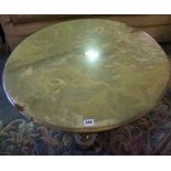Onyx and Gilt Metal Coffee Table, Having a circular top, Raised on three gilt metal Nude male