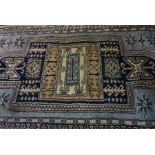 Afghan Rug, Decorated with Geometric medallions on a blue ground, 163cm x 99cm
