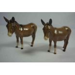 Two Beswick Figures of Donkeys, Marked to underside, 11cm, 12cm high, (2)