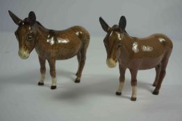 Two Beswick Figures of Donkeys, Marked to underside, 11cm, 12cm high, (2)