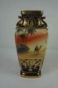 Noritake Vase, Having a Pictoral panel of a Dessert scene, Decorated with Gilded panels on a Blue