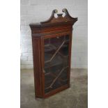 Georgian Inlaid Mahogany Wall Hanging Corner Cabinet, Having a Gilt broken Swan pediment above a