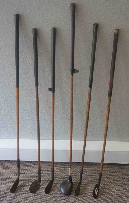 Six Vintage Hickory Shafted Golf Clubs, Makers names worn, To include a 2 Iron, Wooden Headed