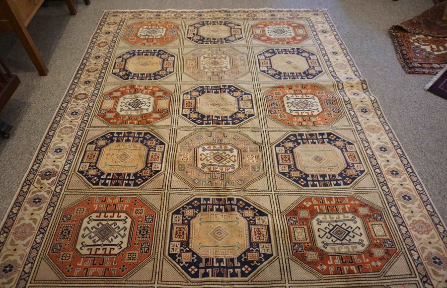 Turkish Herekeh Rug, Decorated with six rows of three Geometric Medallions on a Beige ground,