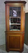 Mahogany Corner Cabinet on Base, circa 19th century, Having an Astragal Door enclosing a Shelved