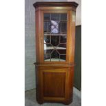 Mahogany Corner Cabinet on Base, circa 19th century, Having an Astragal Door enclosing a Shelved