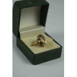 9ct Gold and Citrine Ring, The Citrine stone measuring approximately 1.5cm diameter, Stamped 375,