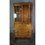 Vintage Oak Bureau Bookcase, Having two Glazed Doors enclosing a Shelved interior, Above a Fall