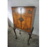 Queen Anne Style Figured Walnut Cocktail Cabinet, Having two Doors, Raised on Cabriole legs with