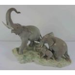 Lladro Porcelain Elephant Figure Group, Modelled as a Family of Elephants, Raised on a