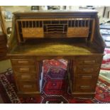 Oak Roll Top Desk, circa early 20th century, Having fitted Drawers and Pigeon holes above four