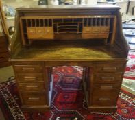 Oak Roll Top Desk, circa early 20th century, Having fitted Drawers and Pigeon holes above four