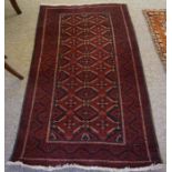 Turkish Rug, Decorated with Geometric Medallions on a Red ground, 168cm x 93cm