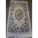 Chinese Style Rug, Decorated with Floral Motifs on a Cream ground, 180cm x 94cm