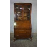 Vintage Oak Bureau Bookcase, Having two Glazed Doors enclosing a Shelved interior, Above a Fall