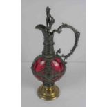 Renaissance Style Pewter and Cranberry Glass Claret Jug, The Stopper is modelled as a Putti