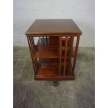 Mahogany Revolving Bookcase, Having two Open sections, Raised on Quadrapartite legs with castors,