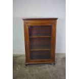 Vintage Mahogany Display Cabinet, Having a Glazed Door enclosing Wooden shelves, Raised on