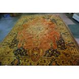 Indian Carpet, Decorated with allover floral medallions on a rust ground, 365cm x 276cm