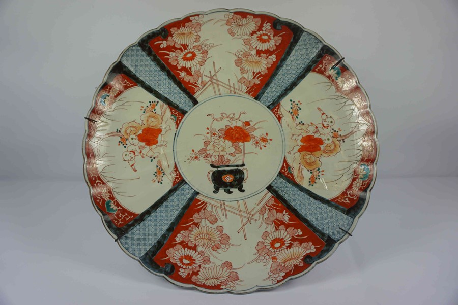 Japanese Imari Charger, circa late 19th century, Decorated with panels of Buddhist children, Urns