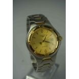 Longines Gents Wristwatch, 100 metres, Quartz movement, Having a Champagne dial, Baton markers, Date