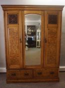 Victorian Walnut Wardrobe, Having a Mirrored Panel, Flanked with two Panelled Doors, Above two