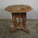 Burmese Style Carved Wood Octagonal Table, Decorated with panels of Figures, 64cm high, 61cm wide